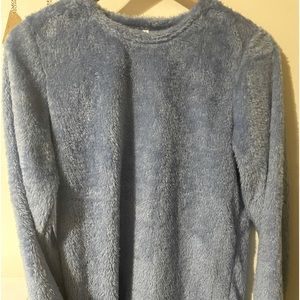 Fluffy small blue sweater.